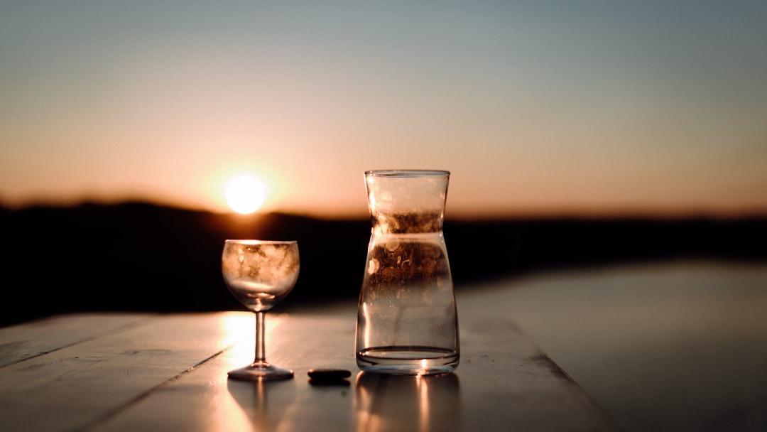 morning routine habits cover image with sunrise, notebook, water glass, and walking shoes by the door