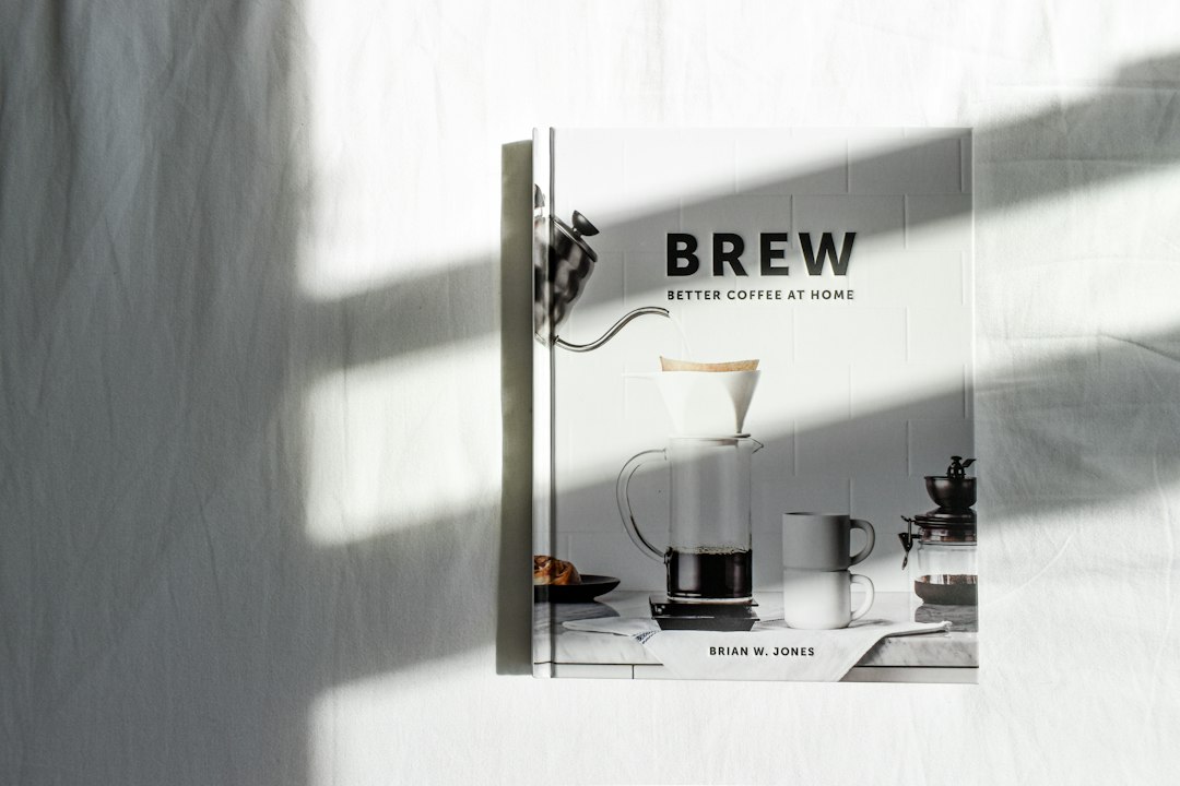Cover image for home coffee brewing showing kettle, dripper, scale, and beans on a wooden table