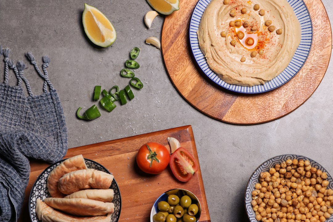 Cover illustration for Mediterranean diet meal planning with colorful produce, olive oil and whole grains arranged on a week planner
